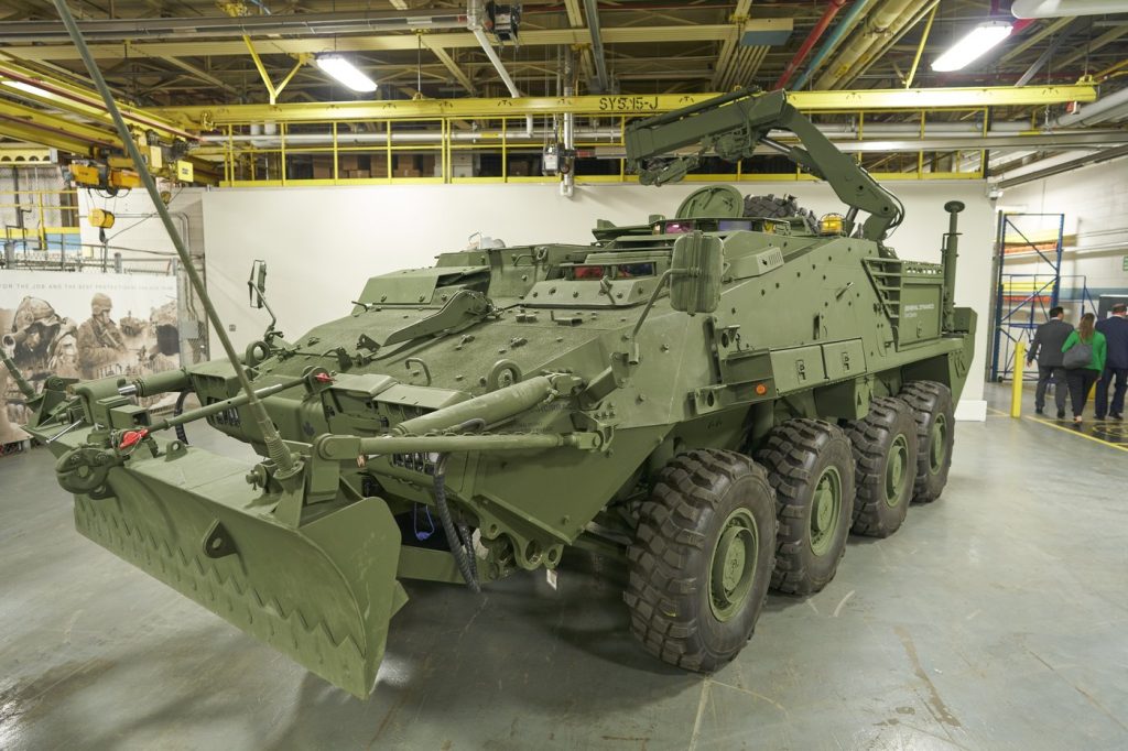 Canadian LAV armoured vehicle inside a steel-framed defence manufacturing facility